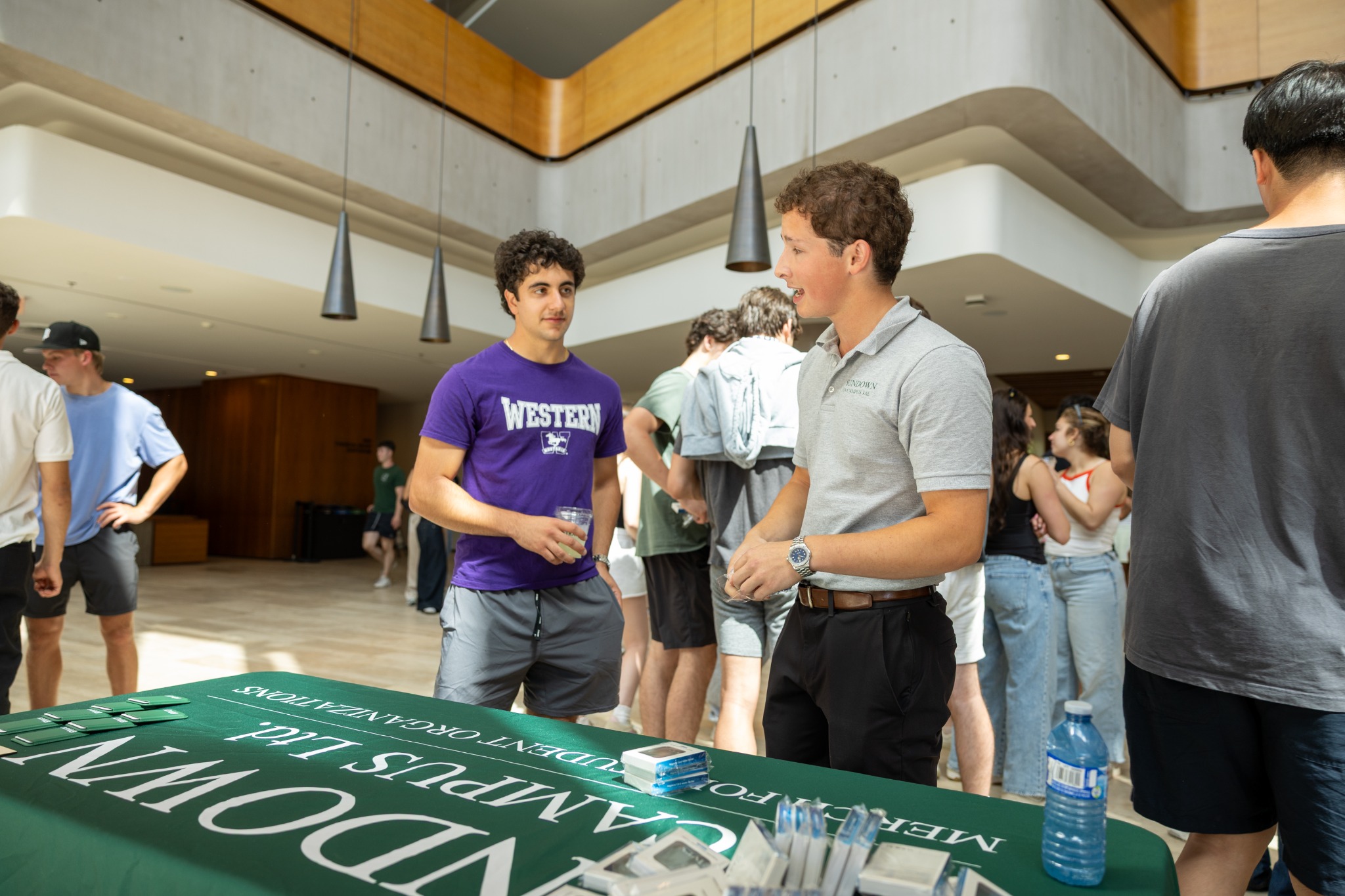 Student Merch founder Jonah Shapiro speaking with Western students at an on-campus event
